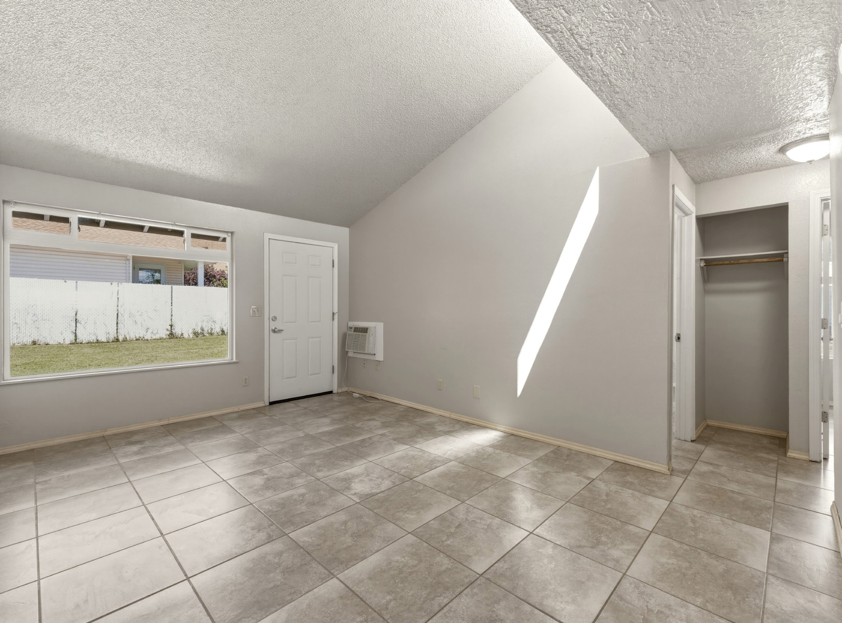 Interior living room with vaulted ceiling
